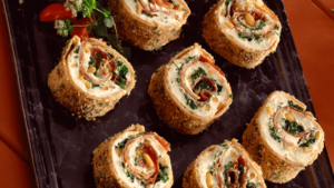 PINWHEEL APPETIZERS WITH TORTILLAS, SPINACH, CREAM CHEESE, HERBS